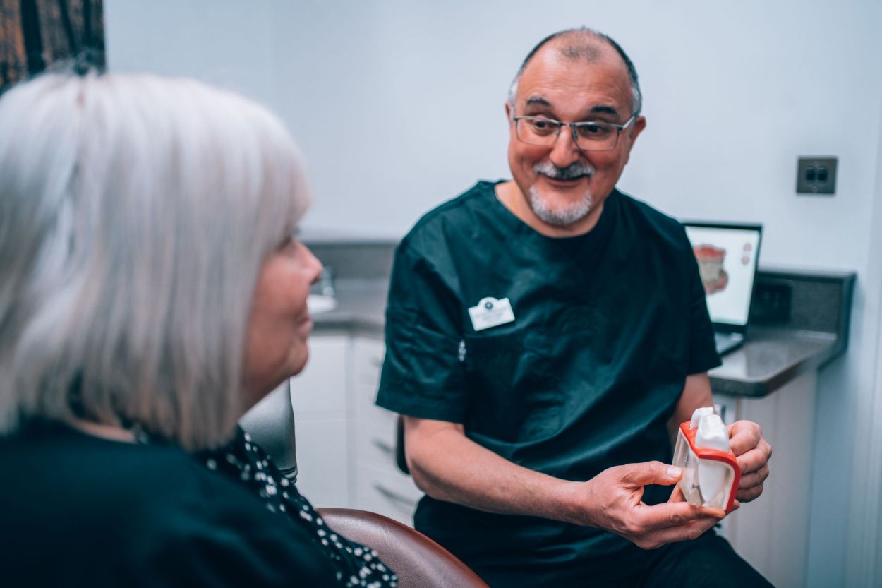 dentist discussing implants with a patient